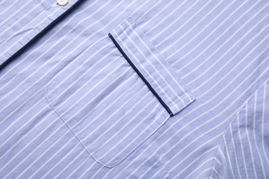 Striped shirt with pocket as background, top view