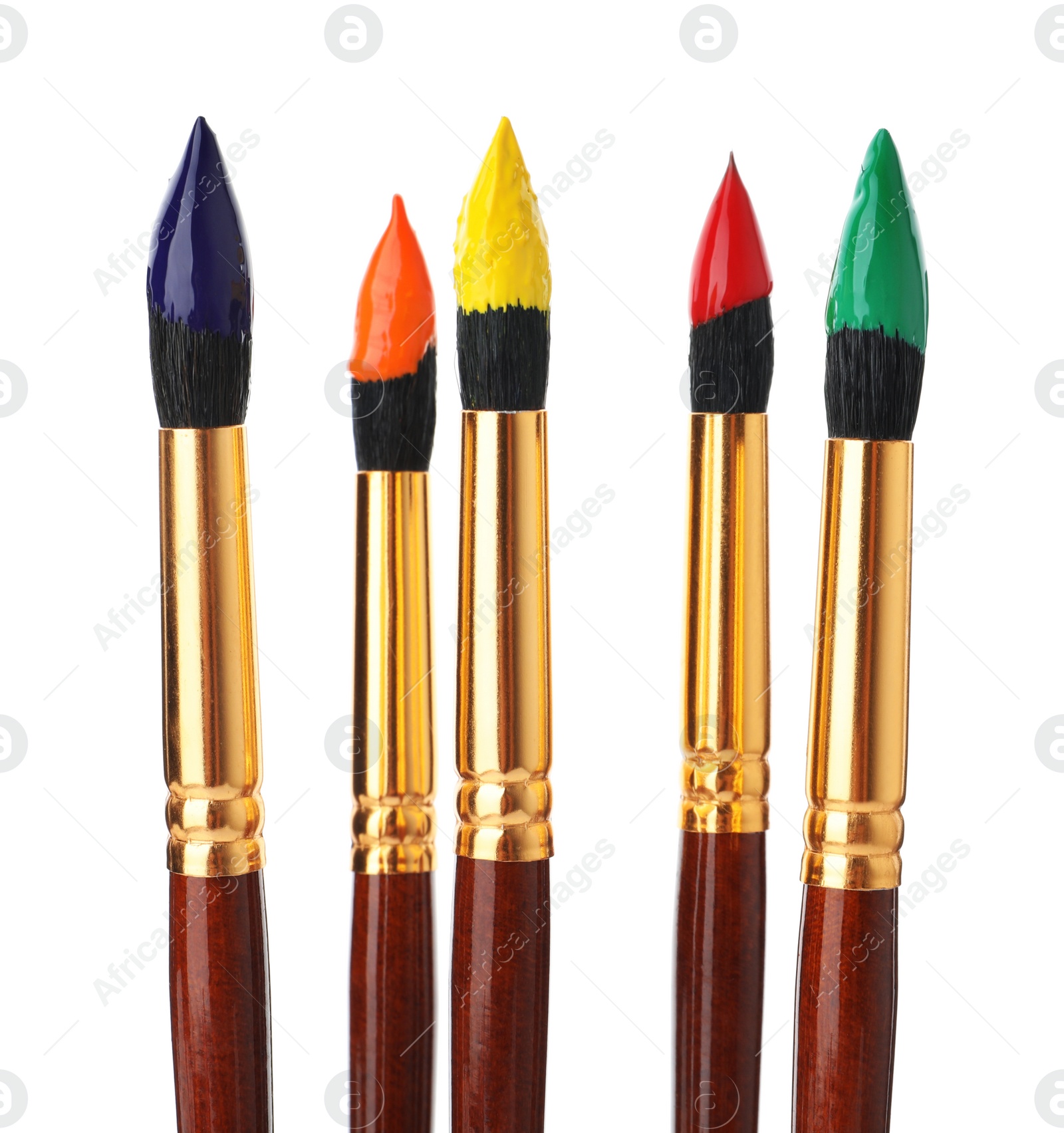 Photo of Brushes with colorful paints on white background