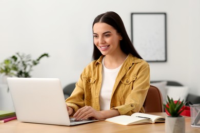 Online translation course. Student typing on laptop at home