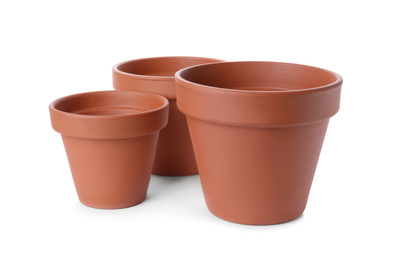 Stylish terracotta flower pots isolated on white