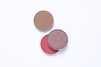 Different beautiful eye shadows on white background, flat lay