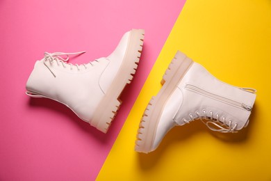 Photo of Pair of stylish leather shoes on color background, flat lay