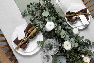 Photo of Luxury table setting with beautiful decor and blank cards. Festive dinner