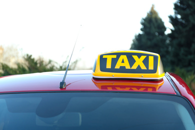 Roof light with word TAXI on car outdoors