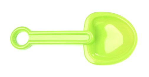 Photo of Green plastic toy shovel isolated on white, top view