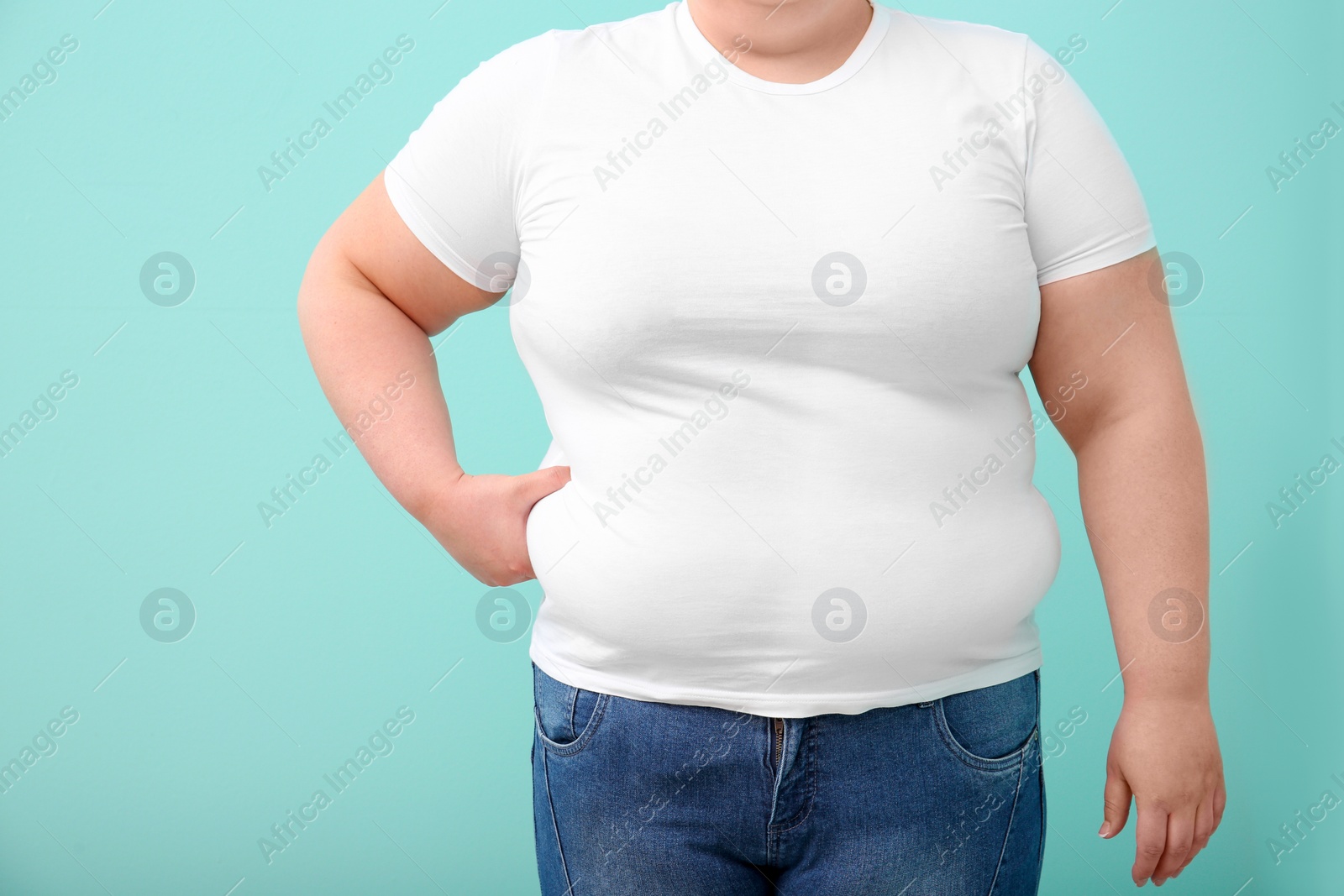 Photo of Overweight woman on color background