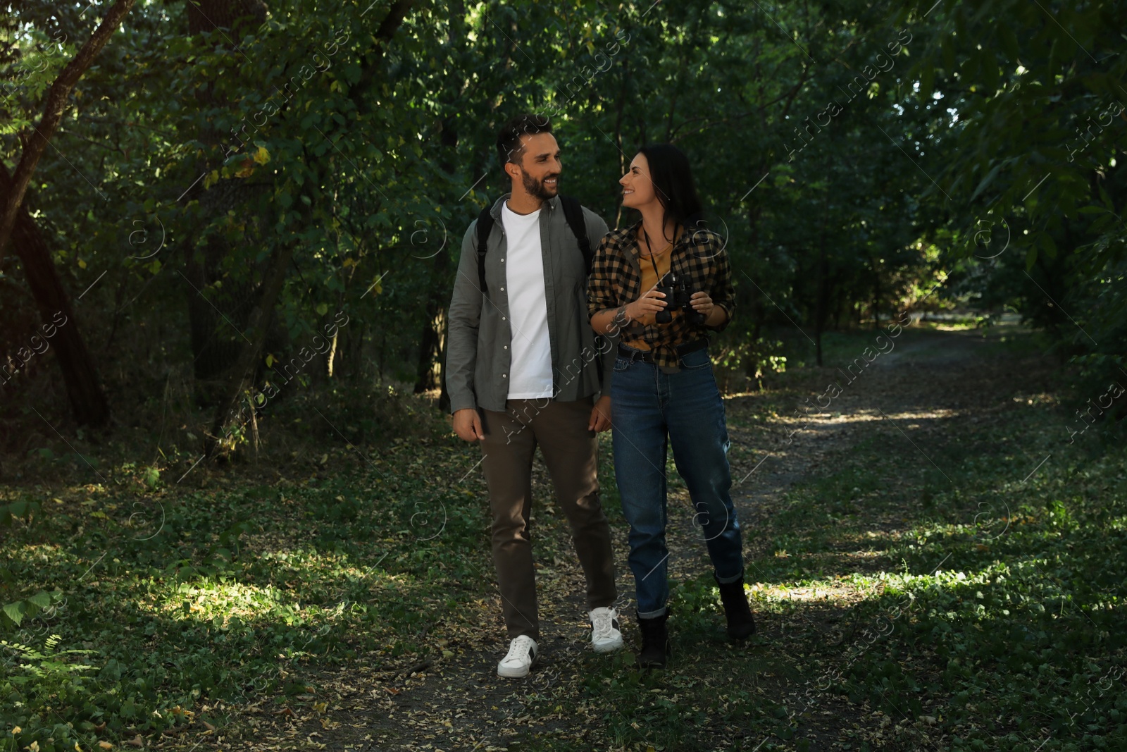 Photo of Lovely couple spending time together in nature reserve