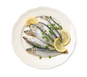 Photo of Fresh raw sprats, green onion and cut lemon isolated on white, top view