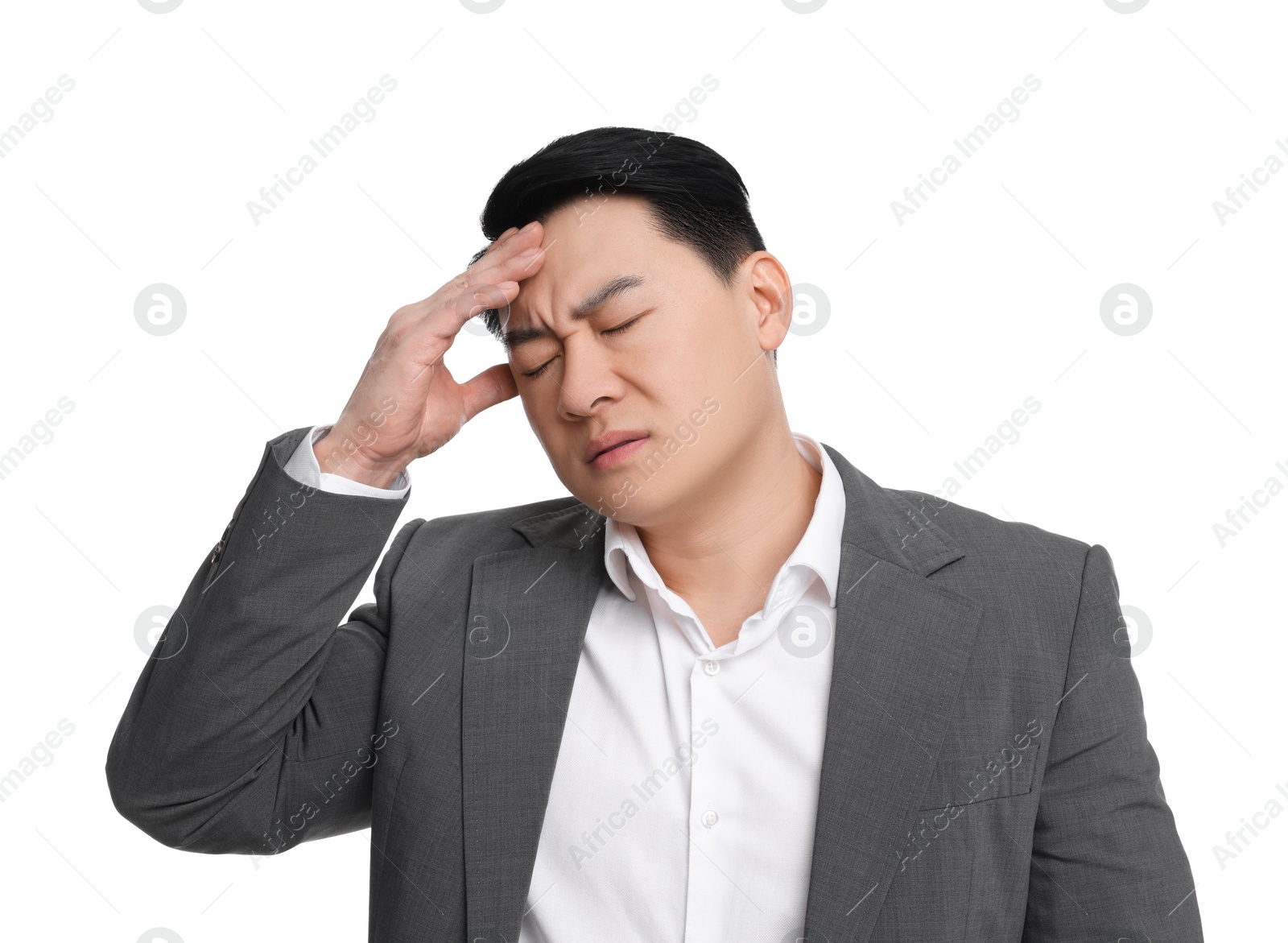 Photo of Tired businessman in suit suffering from headache on white background