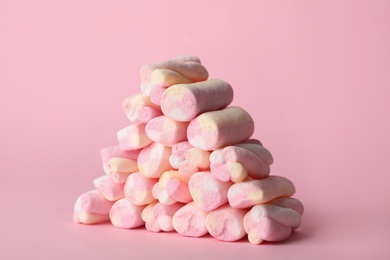 Photo of Stack of tasty marshmallows on pink background