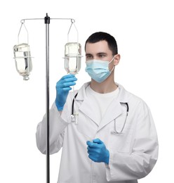 Doctor setting up IV drip on white background