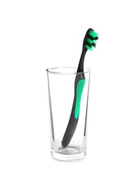 Photo of Cup with toothbrush on white background. Dental care