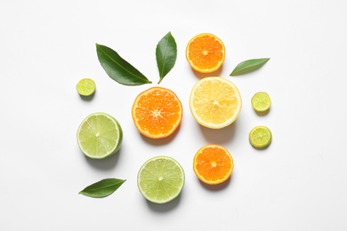 Flat lay composition with different citrus fruits on white background