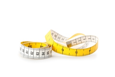 Photo of New yellow measuring tape isolated on white