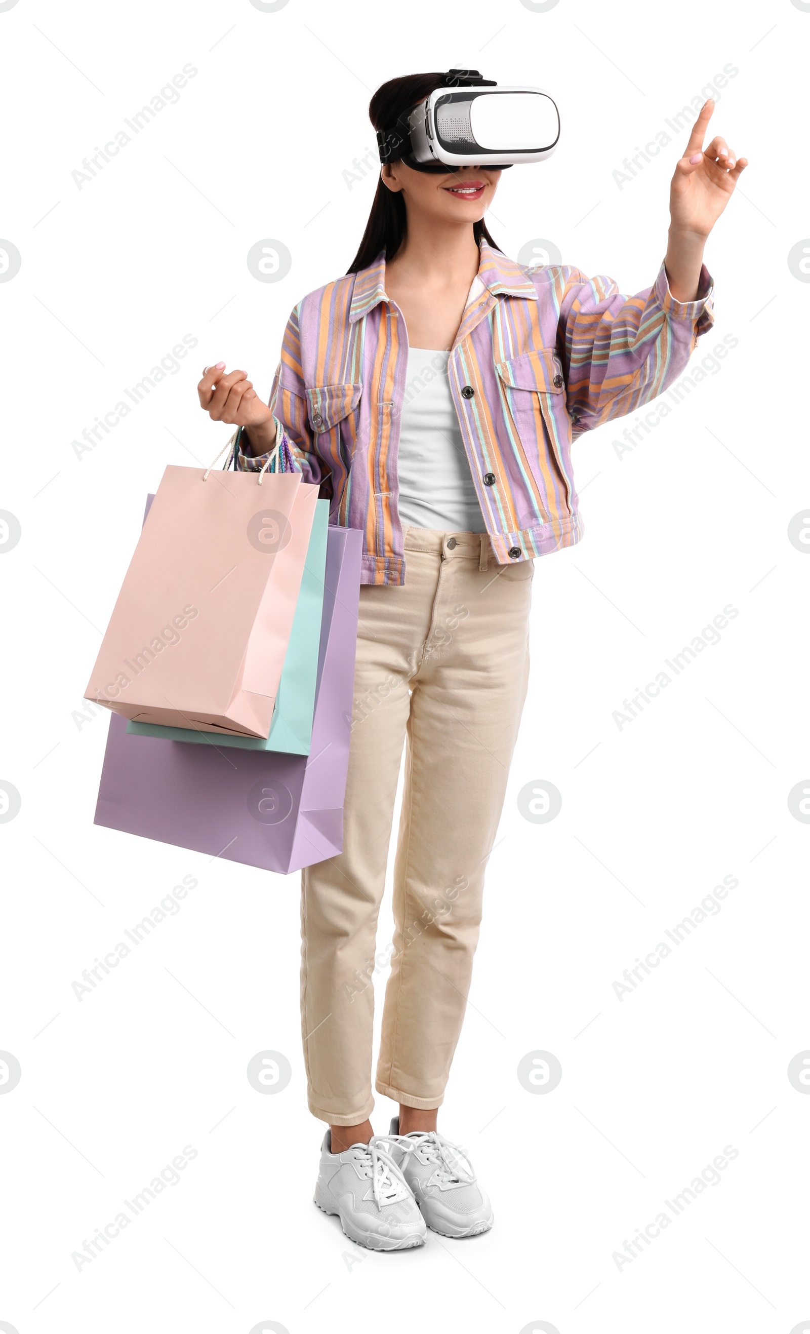 Photo of Woman using virtual reality headset on white background