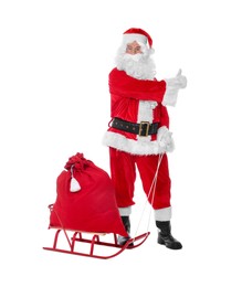 Man in Santa Claus costume with bag and sleigh on white background