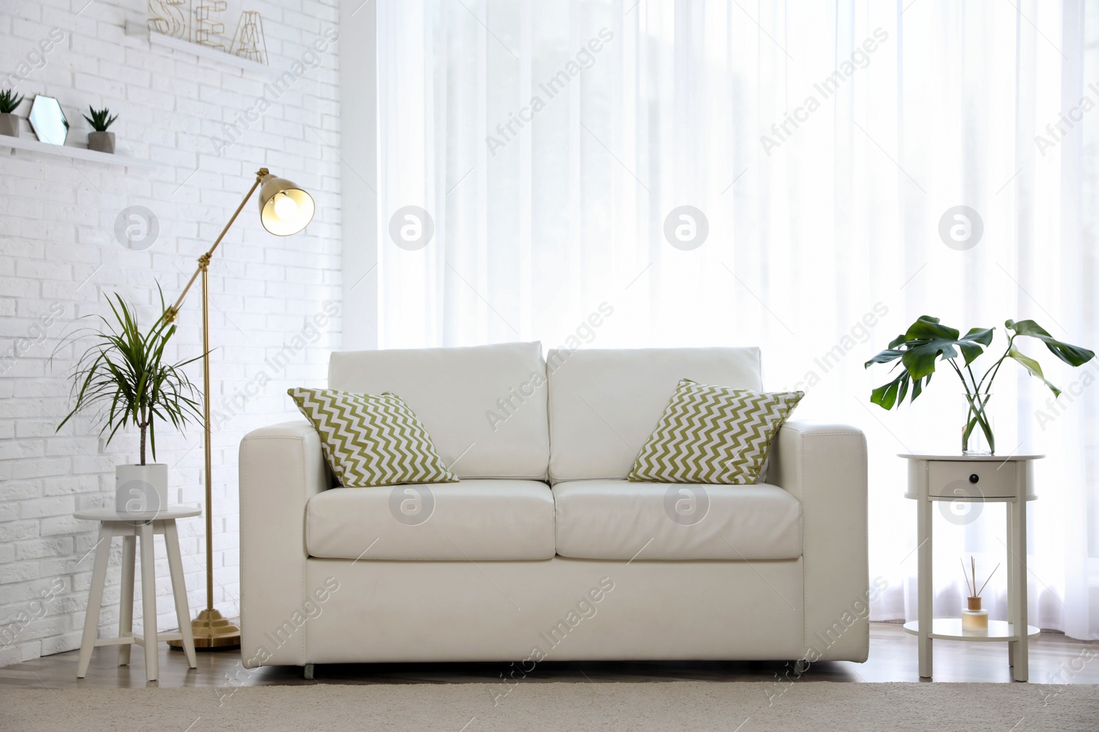 Photo of Stylish room interior with green home plants