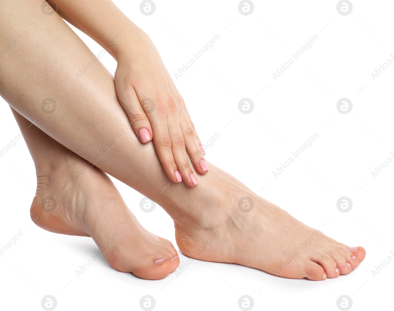 Photo of Woman with neat toenails after pedicure procedure isolated on white, closeup