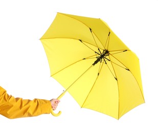 Woman with open yellow umbrella on white background, closeup