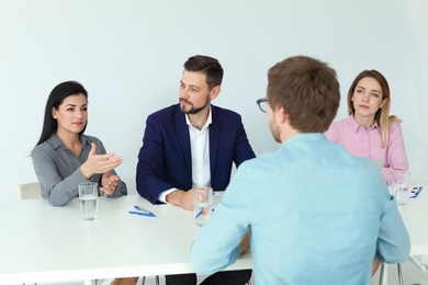 Human resources commission conducting job interview with applicant in office