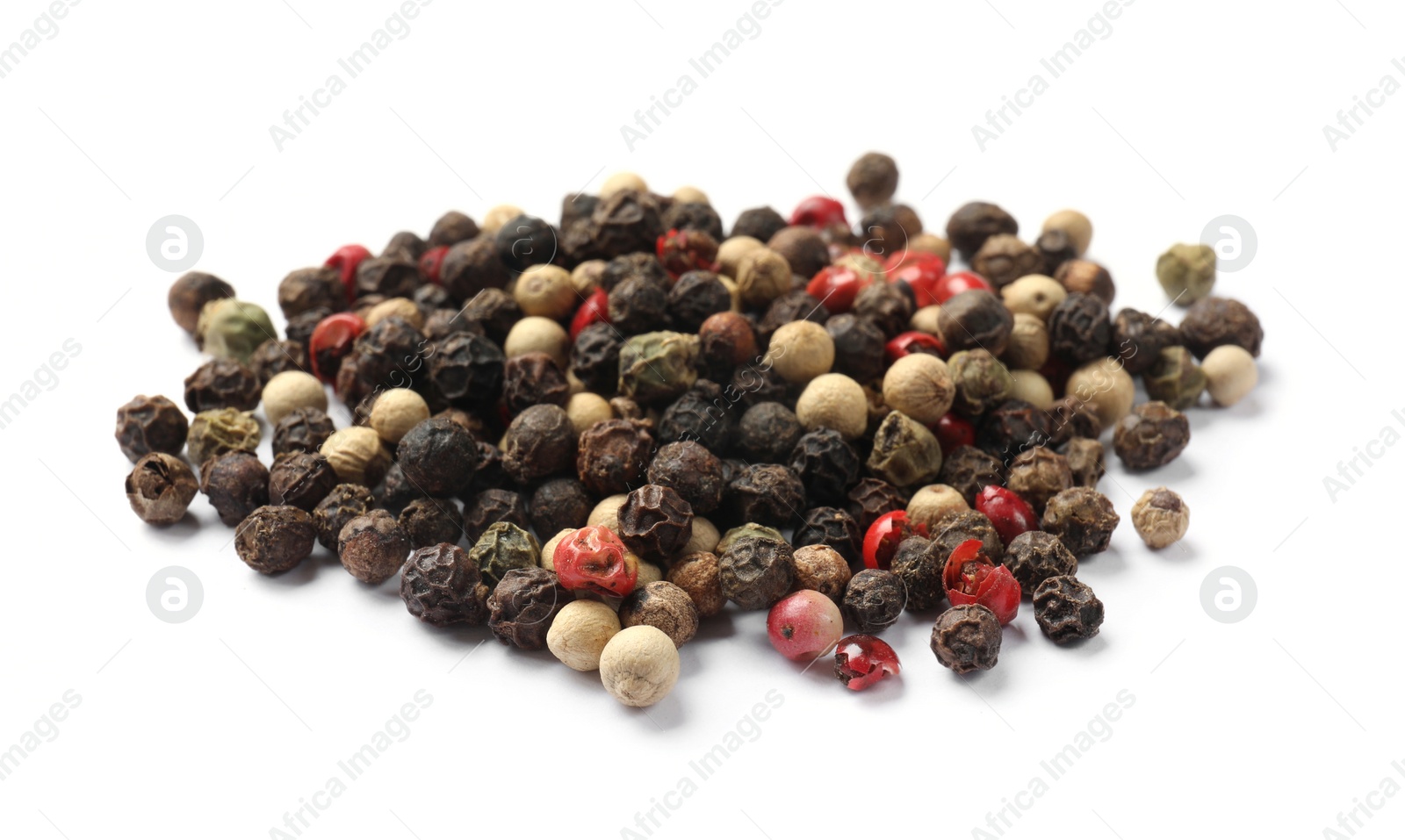 Photo of Aromatic spices. Pile of different peppers isolated on white