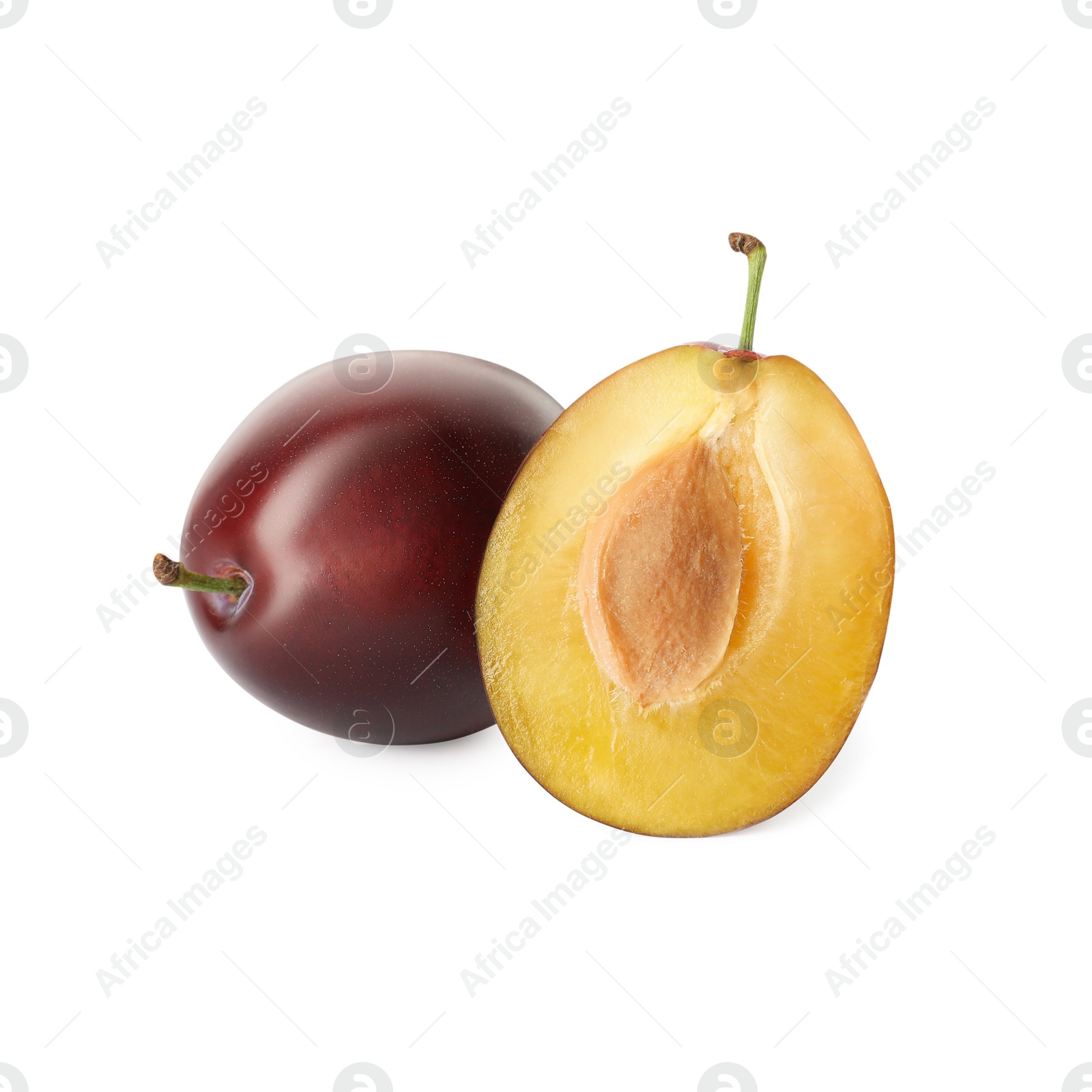 Photo of Whole and cut ripe plums on white background