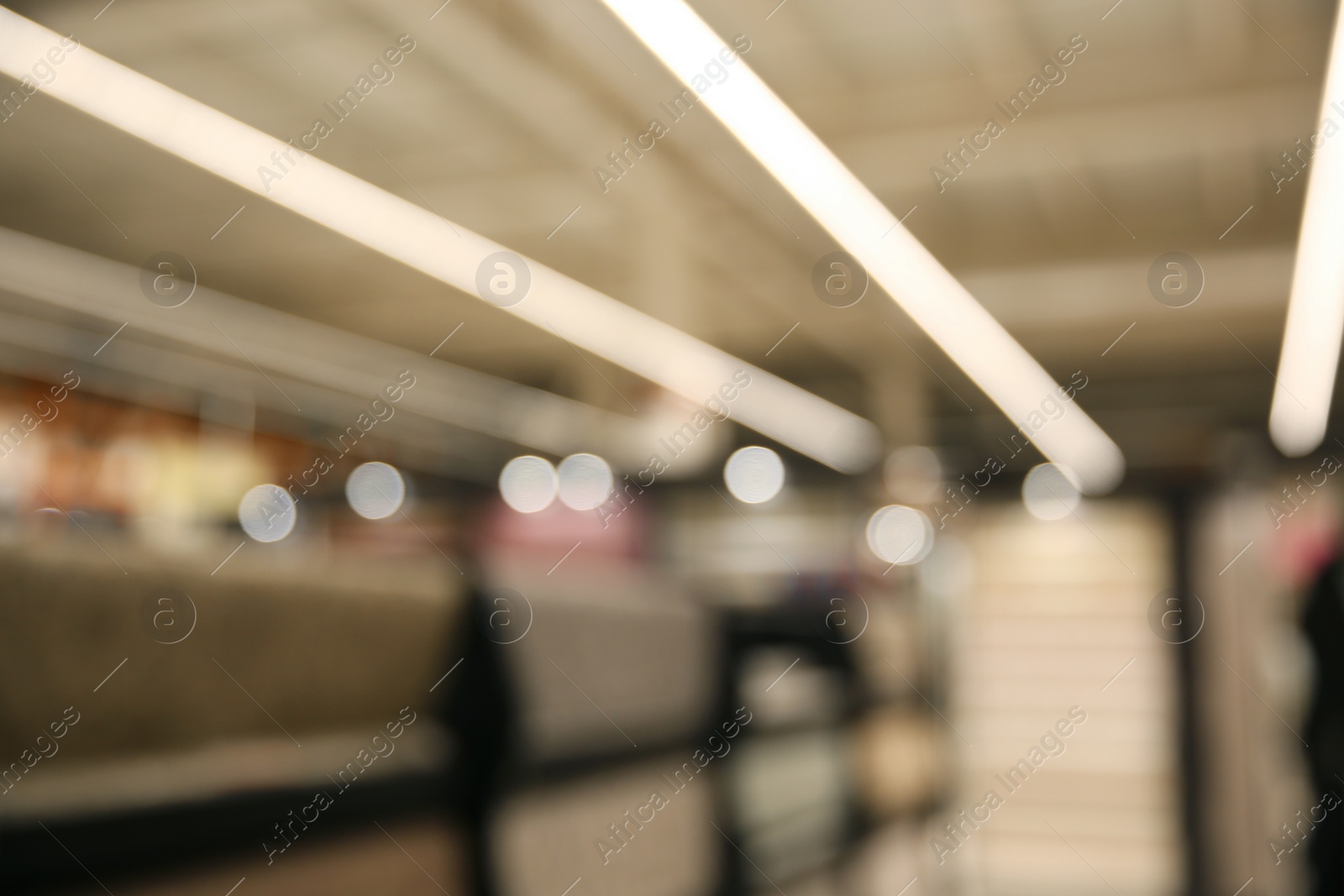 Photo of Blurred view of modern shopping mall interior