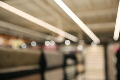 Photo of Blurred view of modern shopping mall interior