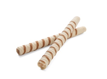 Photo of Tasty wafer roll sticks on white background. Crispy food