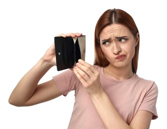 Upset woman with empty wallet on white background