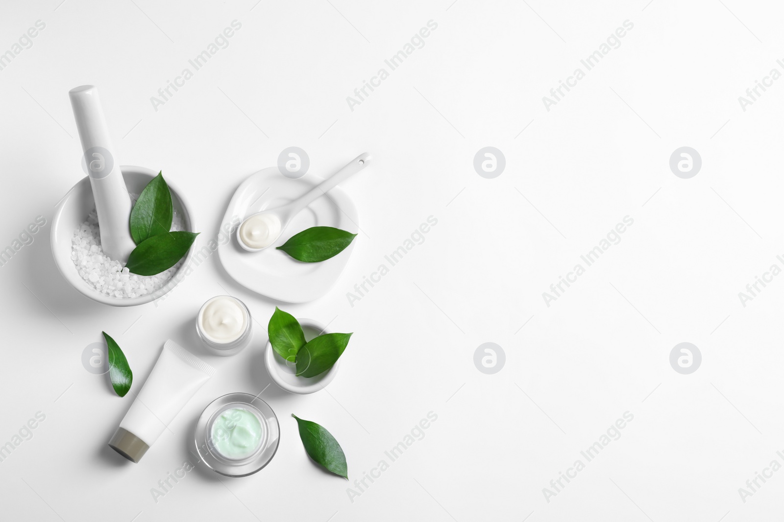 Photo of Flat lay composition with cosmetic products on white background