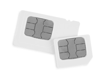 Modern SIM cards on white background, top view