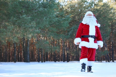 Photo of Happy Authentic Santa Claus walking outdoors. Space for text