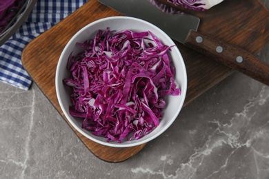 Photo of Flat lay composition with shredded red cabbage on marble table