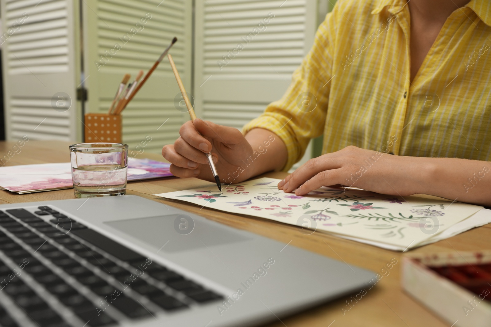 Photo of Woman drawing picture at online art lesson indoors, closeup. Distant learning