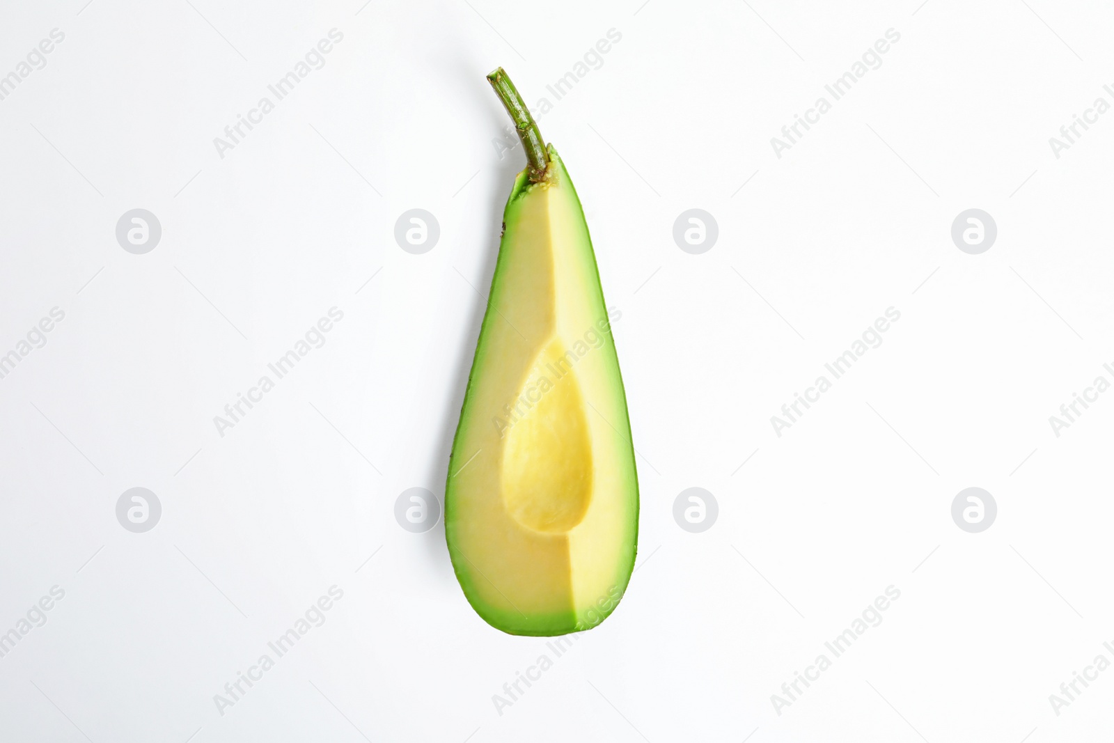 Photo of Slice of avocado on white background