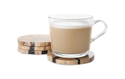 Glass mug of coffee and stylish wooden cup coasters on white background