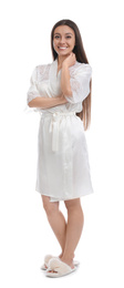 Photo of Young woman in silk robe on white background