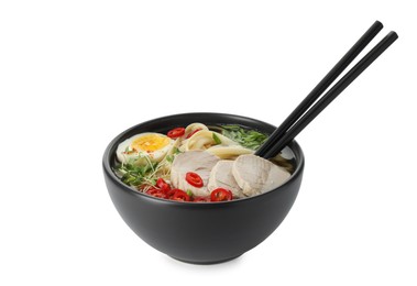 Photo of Delicious ramen with meat and egg in bowl isolated on white. Noodle soup