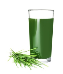 Glass of spirulina drink and wheat grass on white background