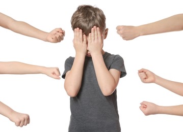 Kids with clenched fists and upset boy on white background. Children's bullying