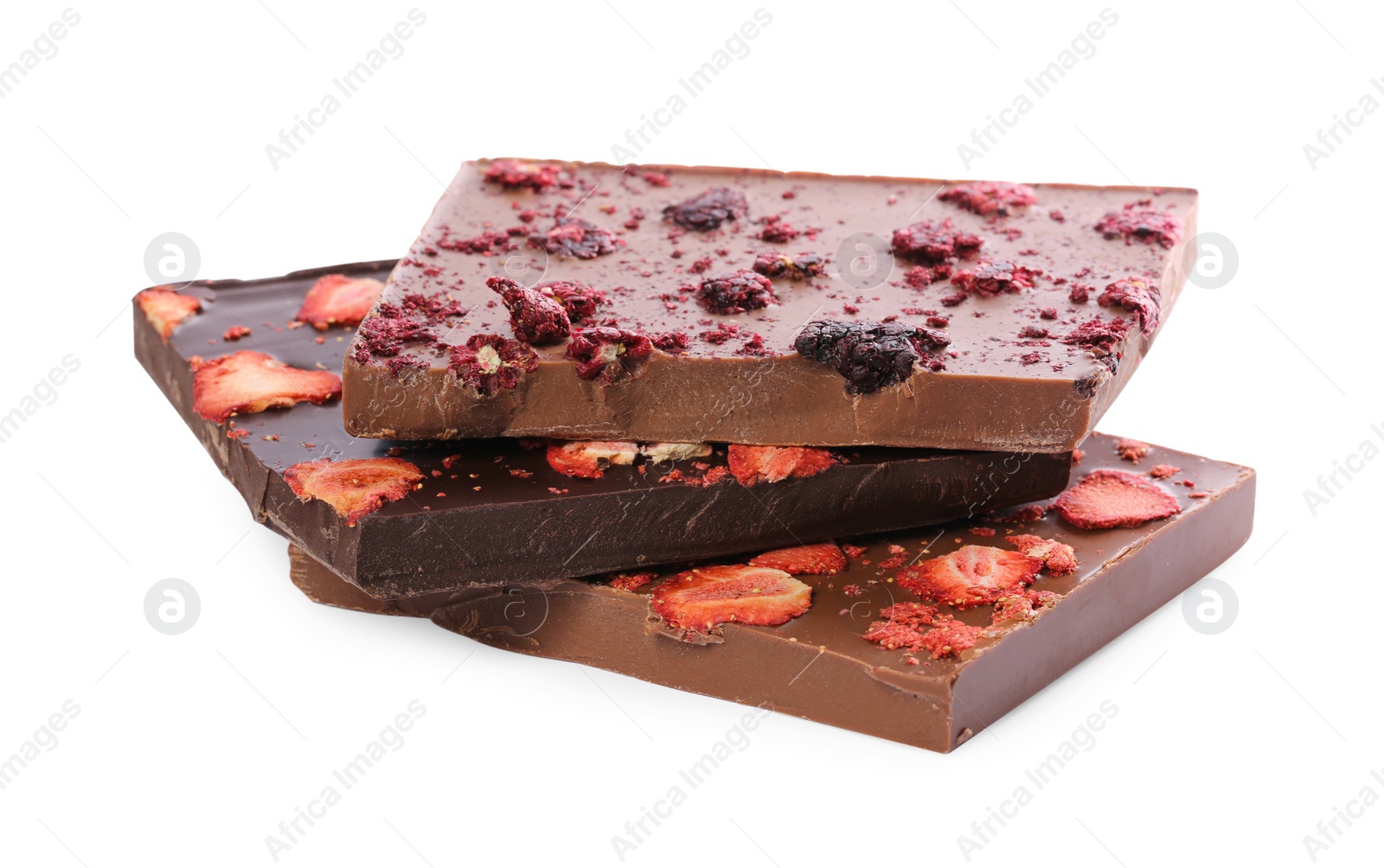 Photo of Halves of chocolate bars with freeze dried berries on white background