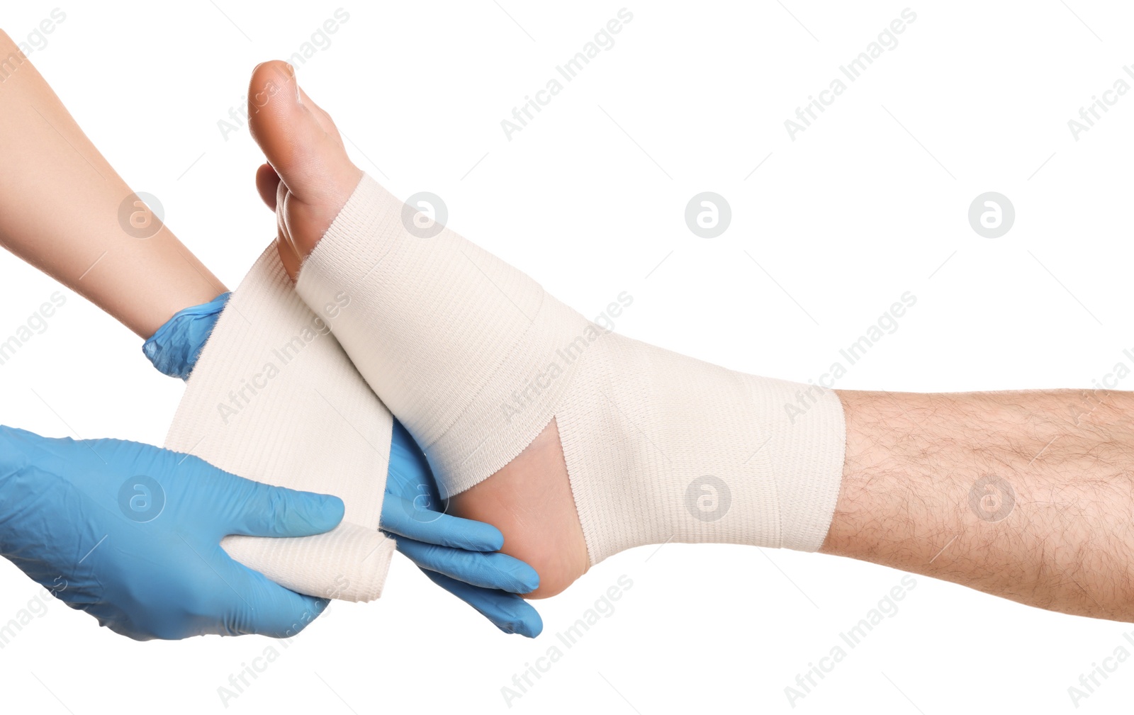 Photo of Doctor applying medical bandage onto patient's foot on white background, closeup