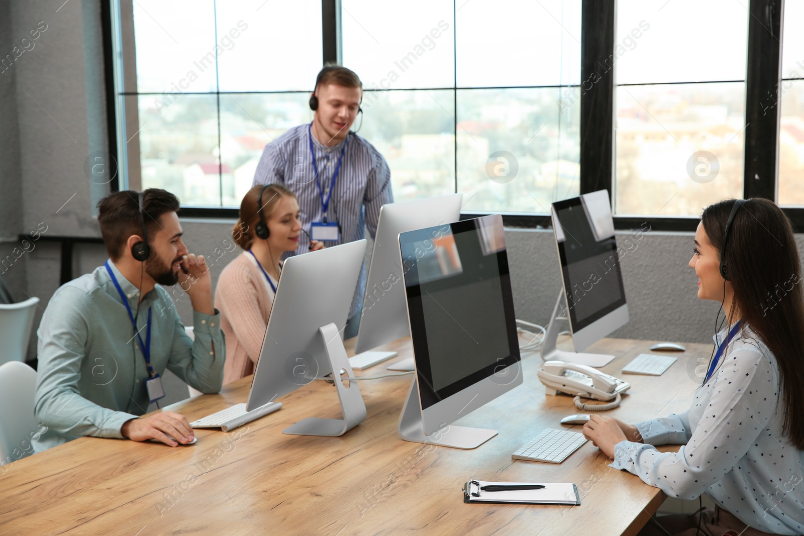 Photo of Technical support operators working in modern office