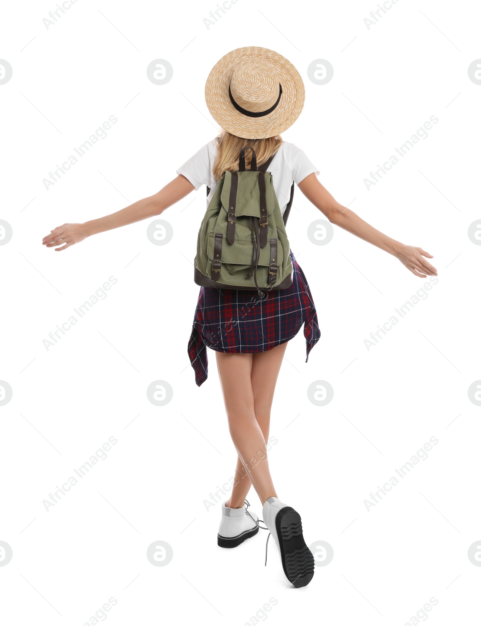 Photo of Woman with backpack and straw hat on white background, back view. Summer travel