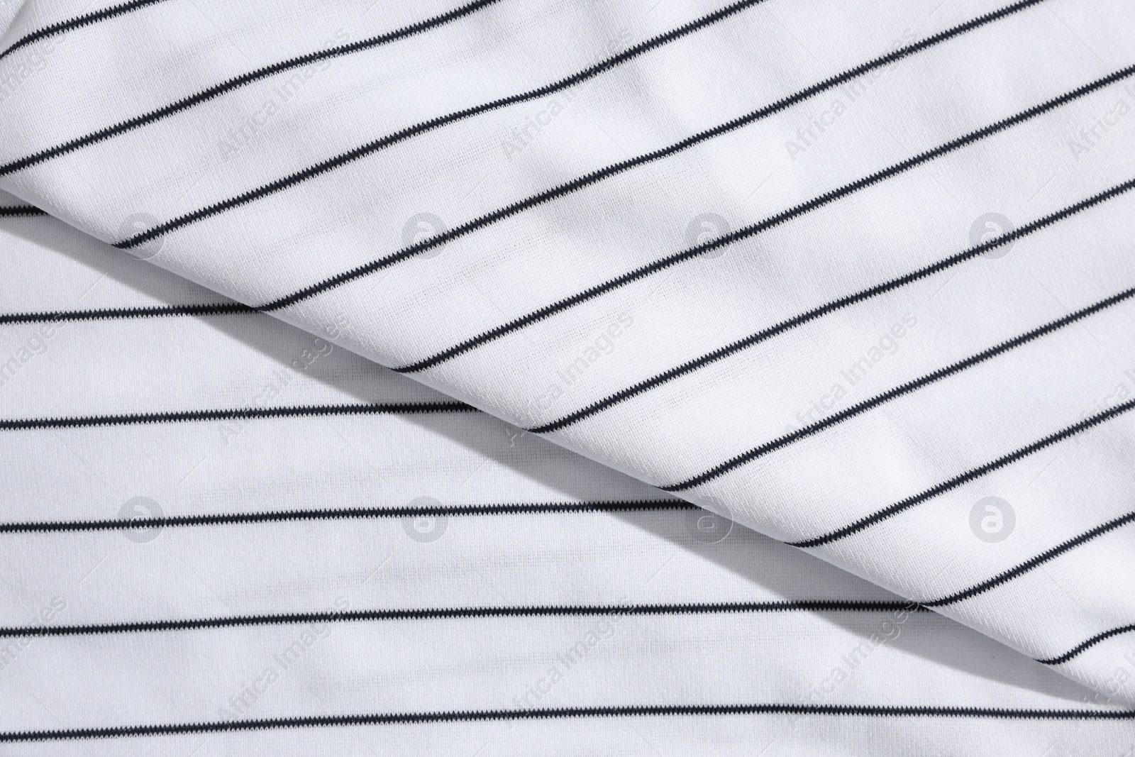 Photo of Striped baseball uniform as background, top view