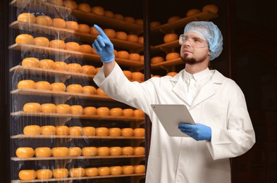 Image of Food quality control specialist examining products in supermarket