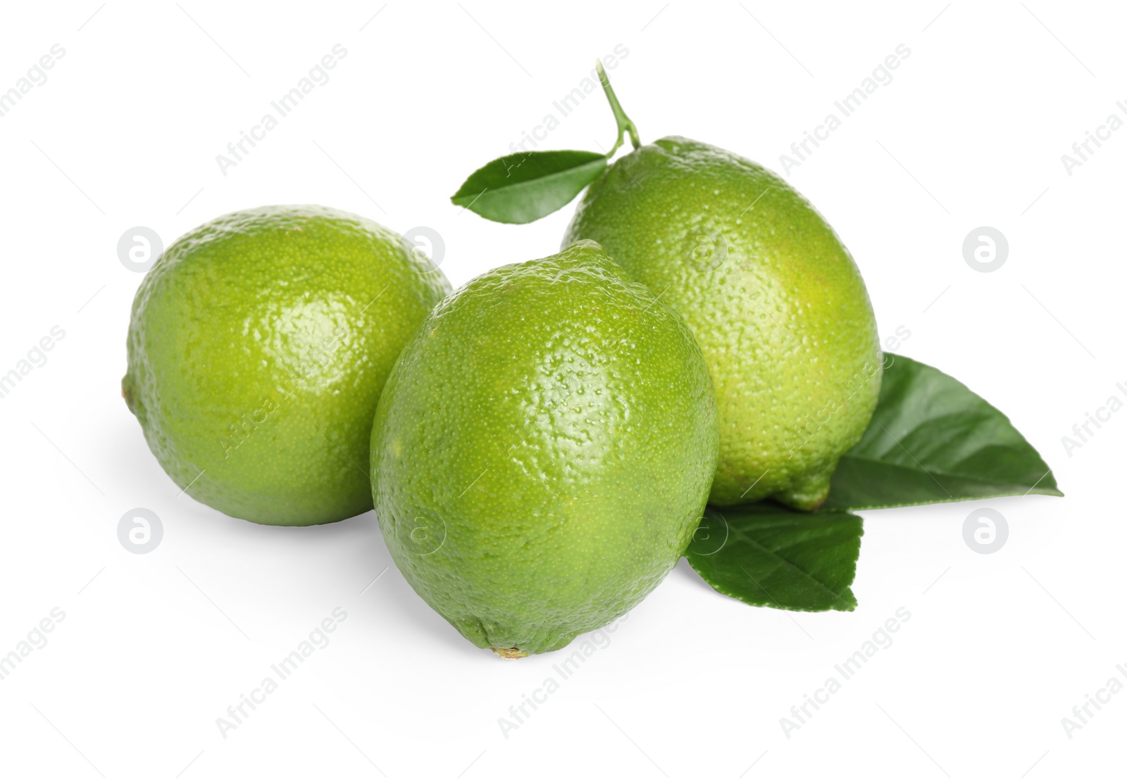 Photo of Fresh ripe limes with green leaves isolated on white