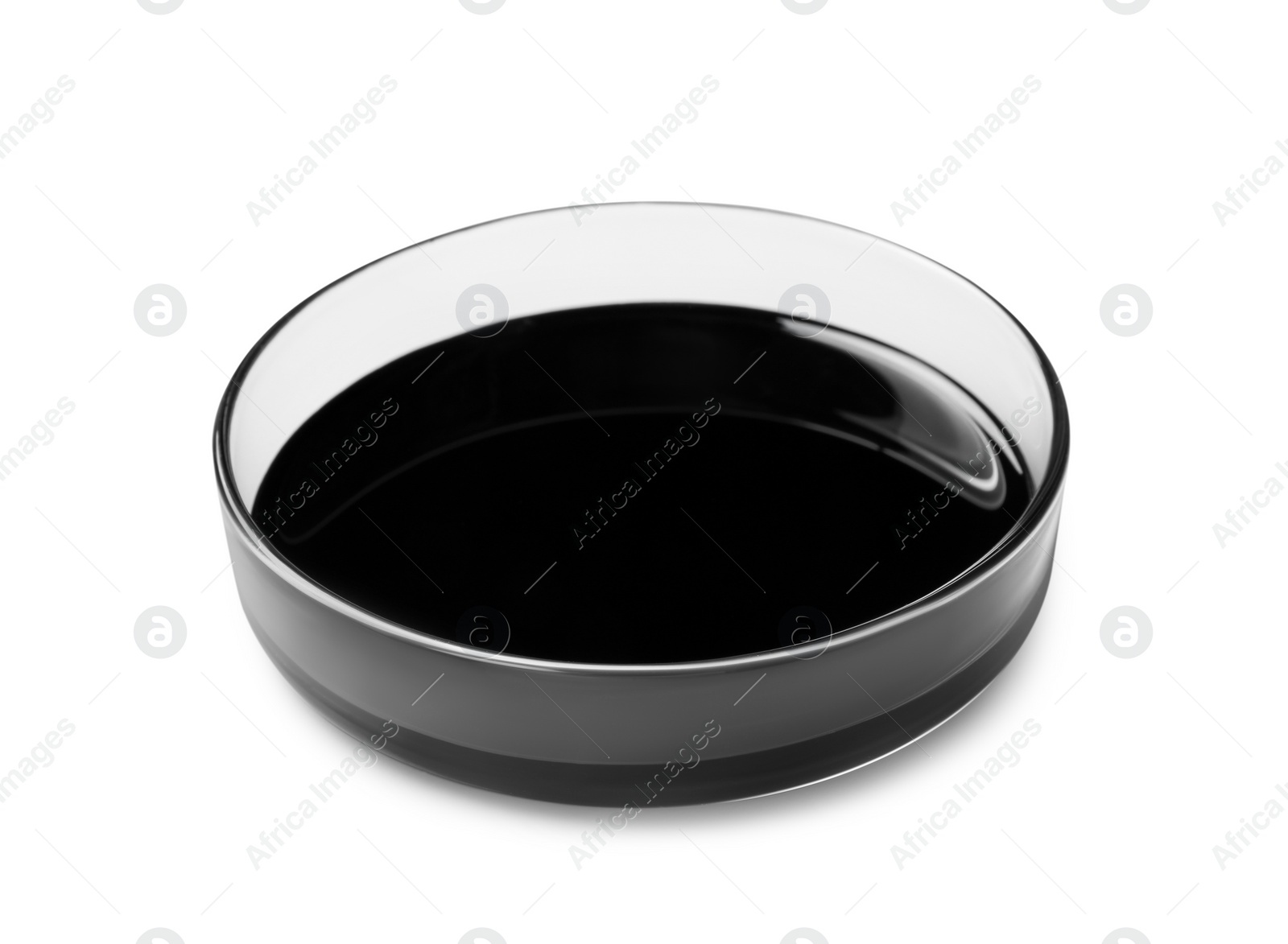 Photo of Black crude oil in Petri dish isolated on white