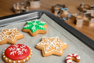 Photo of Tasty colorful Christmas cookies on baking tray